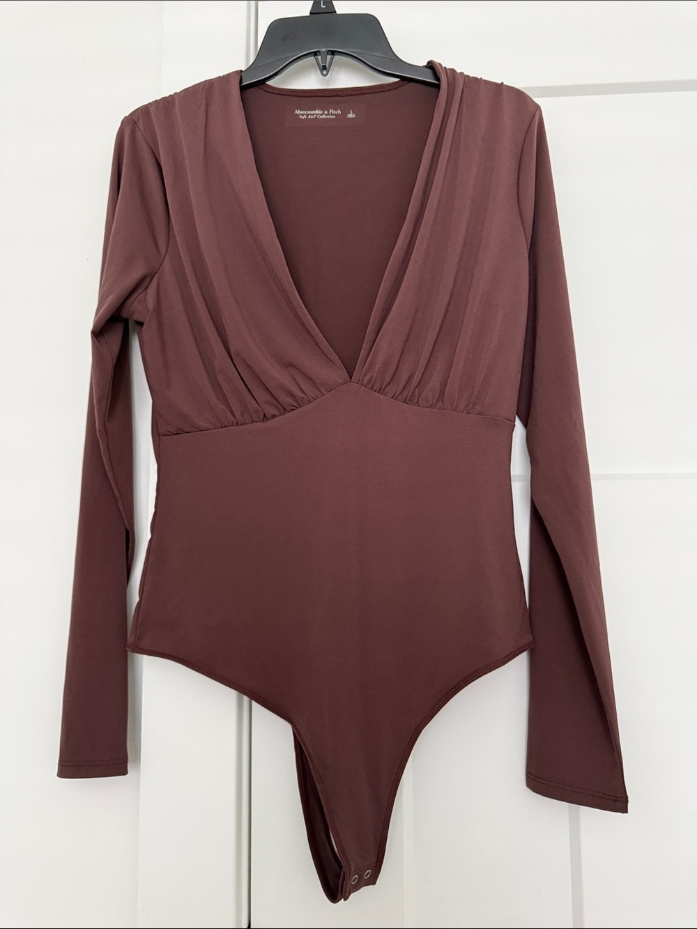 Abercrombie & Fitch Long Sleeve V-Neck One-Piece Bodysuit in chocolate Brown. L.